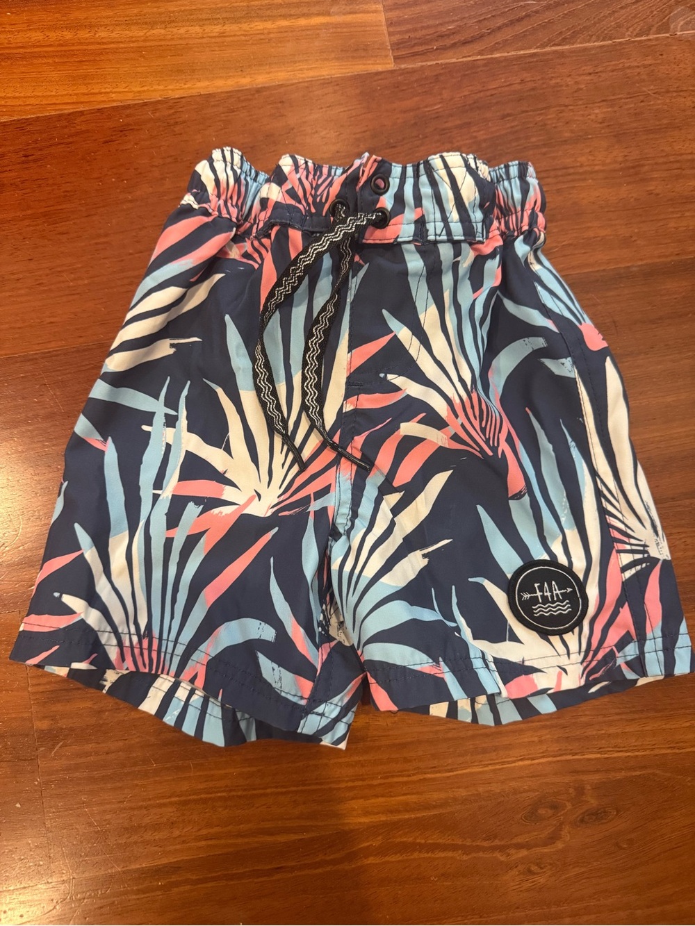Kids Feather 4 Arrow Navy Tropical Print Swim Trunks